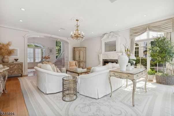 Chandelier, Fireplace, Interior, Living room, Recessed Lighting, Wood Texture Flooring