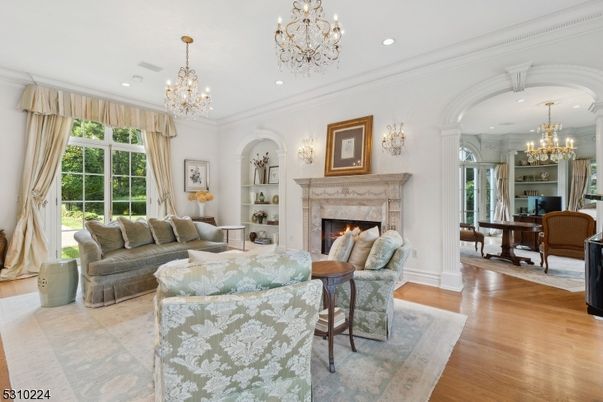 Chandelier, Dining room, Fireplace, Interior, Living room, Recessed Lighting, Wood Texture Flooring