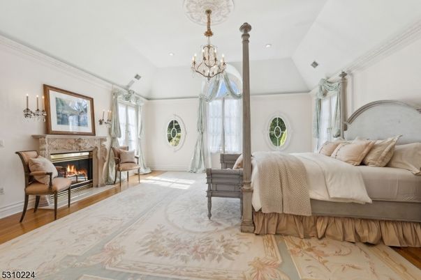 Bedroom, Chandelier, Fireplace, Interior, Recessed Lighting, Wood Texture Flooring