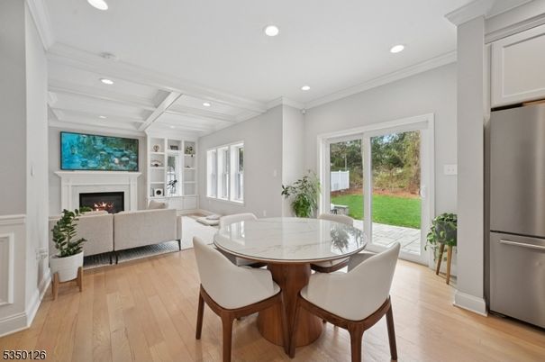 Dining room, Fireplace, Interior, Kitchen, Living room, Recessed Lighting, Stainless Steel Appliances, Wood Texture Flooring