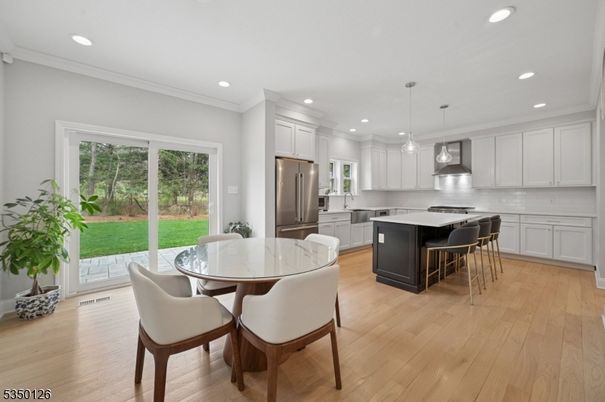 Dining room, Interior, Kitchen, Pendant Lights, Recessed Lighting, Stainless Steel Appliances, Wood Texture Flooring