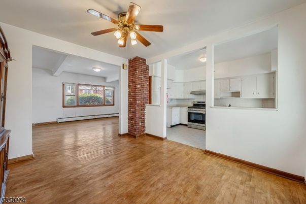 Empty room, Interior, Kitchen, Stainless Steel Appliances, Wood Texture Flooring