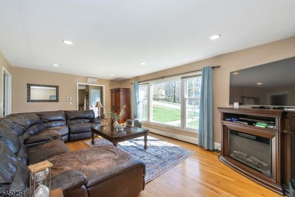 Fireplace, Interior, Living room, Recessed Lighting, Wood Texture Flooring