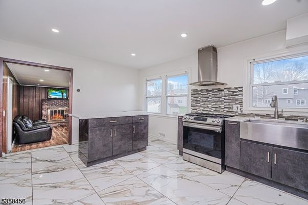 Fireplace, Interior, Kitchen, Living room, Marble, Recessed Lighting, Stainless Steel Appliances