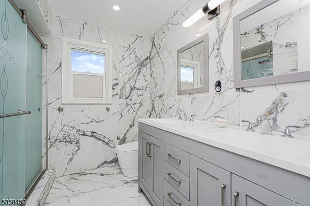 Bathroom, Dual Sink Vanities, Interior, Marble, Marble Walls, Recessed Lighting