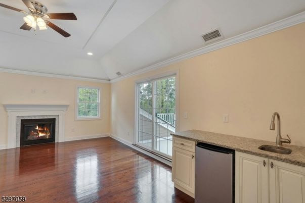 Empty room, Fireplace, Interior, Kitchen, Recessed Lighting, Wood Texture Flooring