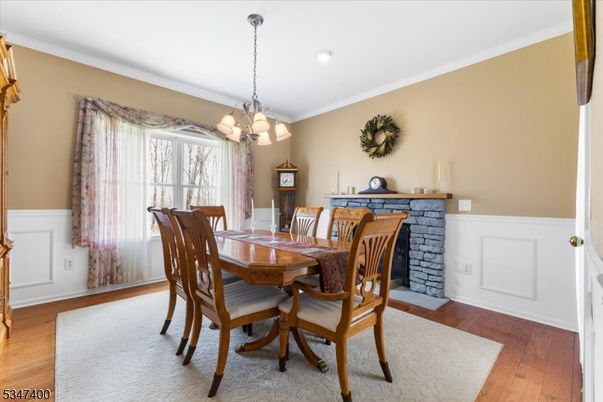 Chandelier, Dining room, Fireplace, Interior, Recessed Lighting, Wood Texture Flooring