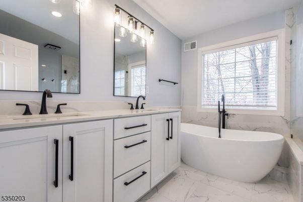 Bathroom, Dual Sink Vanities, Free Standing Baths, Interior, Marble, Marble Walls, Recessed Lighting