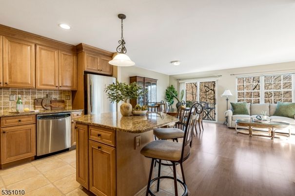 Dining room, Interior, Kitchen, Living room, Pendant Lights, Recessed Lighting, Stainless Steel Appliances, Wood Texture Flooring