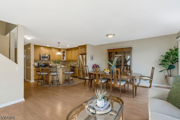 Dining room, Interior, Kitchen, Pendant Lights, Recessed Lighting, Stainless Steel Appliances, Wood Texture Flooring