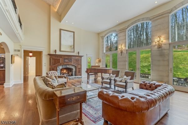 Fireplace, Interior, Living room, Piano, Recessed Lighting, Wood Texture Flooring
