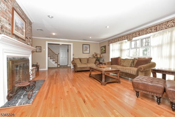 Fireplace, Interior, Living room, Recessed Lighting, Stone Walls, Wood Texture Flooring