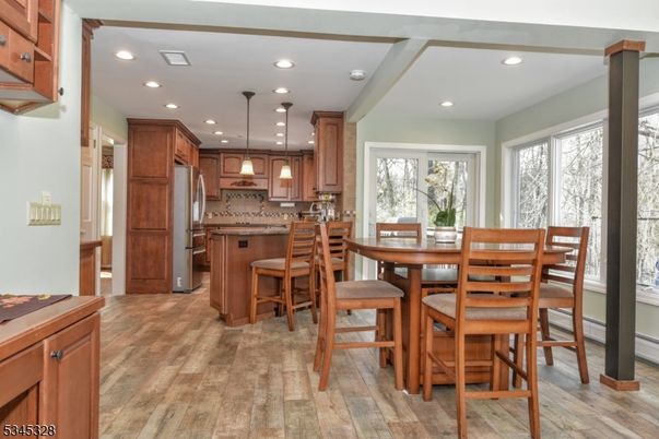 Dining room, Interior, Kitchen, Pendant Lights, Recessed Lighting, Stainless Steel Appliances, Wood Texture Flooring
