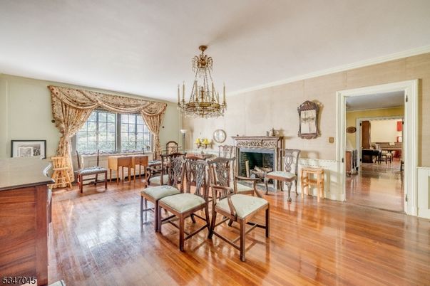 Chandelier, Dining room, Fireplace, Interior, Piano, Wood Texture Flooring