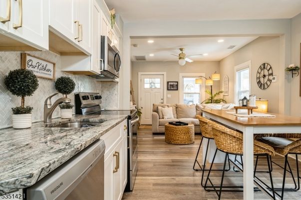 Interior, Kitchen, Living room, Recessed Lighting, Stainless Steel Appliances, Wood Texture Flooring