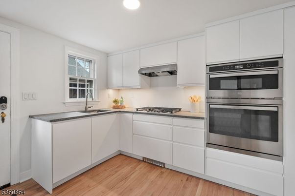 Interior, Kitchen, Recessed Lighting, Stainless Steel Appliances, Wood Texture Flooring