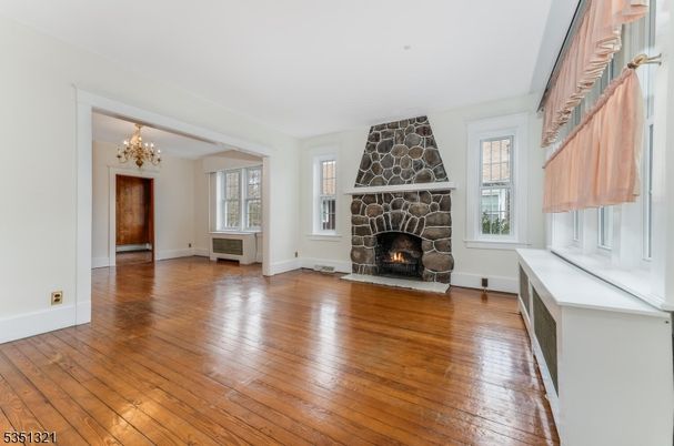 Chandelier, Empty room, Fireplace, Interior, Wood Texture Flooring