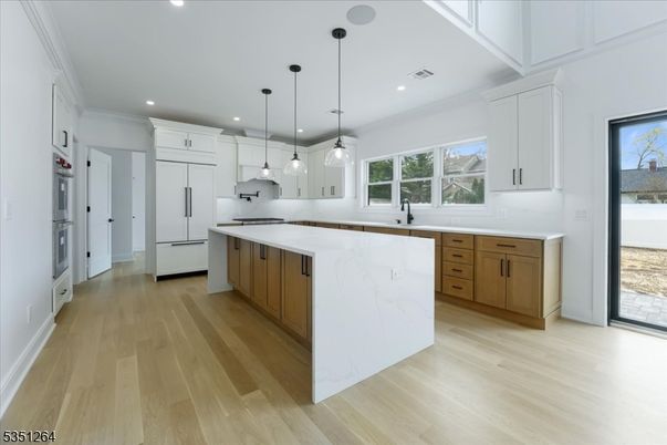 Interior, Kitchen, Marble Walls, Pendant Lights, Recessed Lighting, Wood Texture Flooring