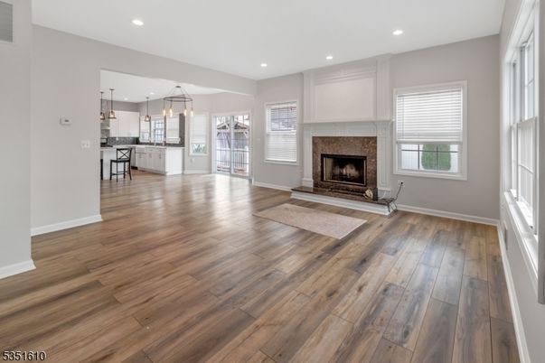 Empty room, Fireplace, Interior, Kitchen, Pendant Lights, Recessed Lighting, Wood Texture Flooring