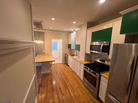 Interior, Kitchen, Pendant Lights, Recessed Lighting, Stainless Steel Appliances, Wood Texture Flooring
