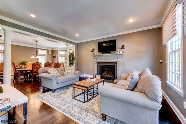 Dining room, Fireplace, Interior, Living room, Pendant Lights, Recessed Lighting, Wood Texture Flooring