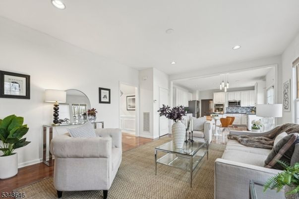 Dining room, Interior, Kitchen, Living room, Pendant Lights, Recessed Lighting, Stainless Steel Appliances, Wood Texture Flooring