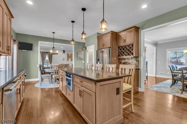 Dining room, Interior, Kitchen, Pendant Lights, Recessed Lighting, Stainless Steel Appliances, Wood Texture Flooring