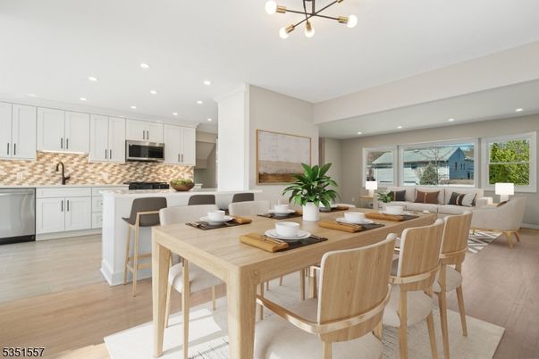 Dining room, Interior, Kitchen, Pendant Lights, Recessed Lighting, Stainless Steel Appliances, Wood Texture Flooring
