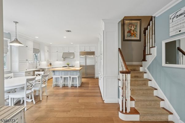 Dining room, Interior, Kitchen, Pendant Lights, Recessed Lighting, Stainless Steel Appliances, Wood Texture Flooring