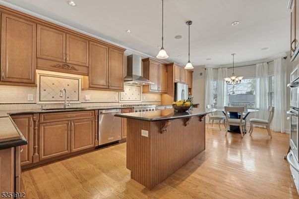 Chandelier, Dining room, Interior, Kitchen, Pendant Lights, Recessed Lighting, Stainless Steel Appliances, Wood Texture Flooring