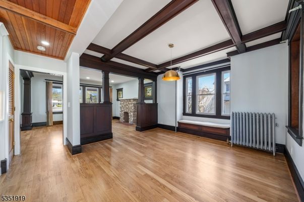 Empty room, Fireplace, Interior, Pendant Lights, Recessed Lighting, Wooden Beams, Wood Texture Flooring