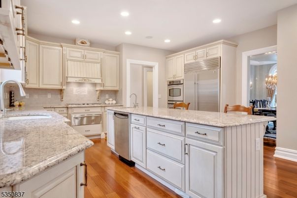 Chandelier, Interior, Kitchen, Recessed Lighting, Stainless Steel Appliances, Wood Texture Flooring