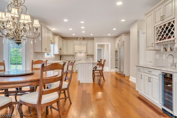 Chandelier, Dining room, Interior, Kitchen, Recessed Lighting, Stainless Steel Appliances, Wood Texture Flooring