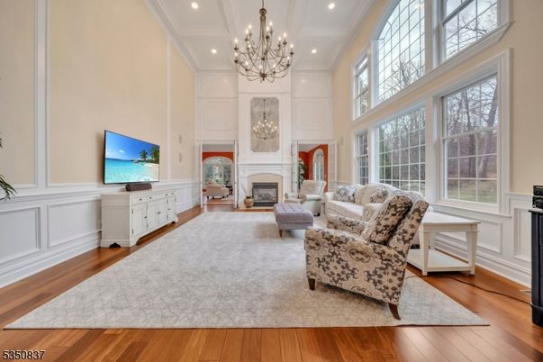 Chandelier, Fireplace, Interior, Living room, Recessed Lighting, Wood Texture Flooring