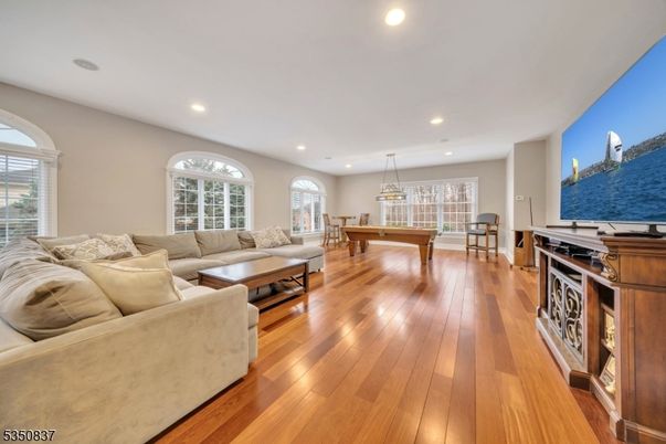 Billiard Table, Chandelier, Game Room, Interior, Living room, Pendant Lights, Recessed Lighting, Wood Texture Flooring