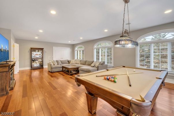 Billiard Table, Game Room, Interior, Living room, Pendant Lights, Recessed Lighting, Wood Texture Flooring