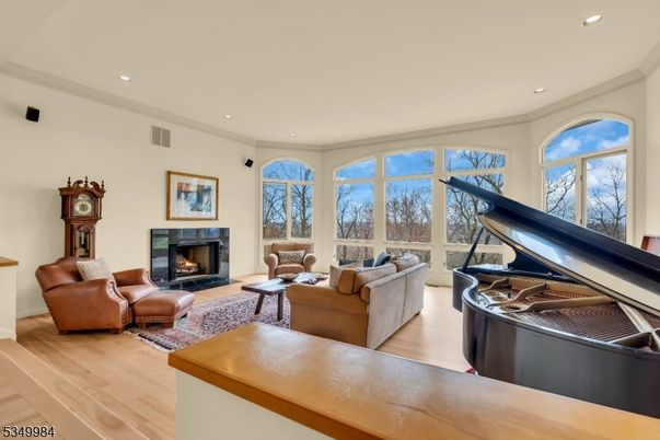 Fireplace, Interior, Living room, Piano, Recessed Lighting, Wood Texture Flooring