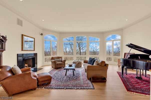 Fireplace, Interior, Living room, Piano, Recessed Lighting, Wood Texture Flooring