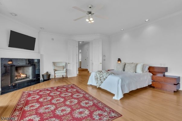 Bedroom, Fireplace, Interior, Recessed Lighting, Wood Texture Flooring