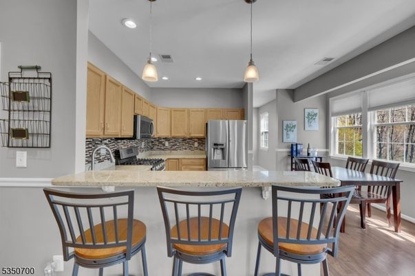 Dining room, Interior, Kitchen, Pendant Lights, Recessed Lighting, Stainless Steel Appliances, Wood Texture Flooring