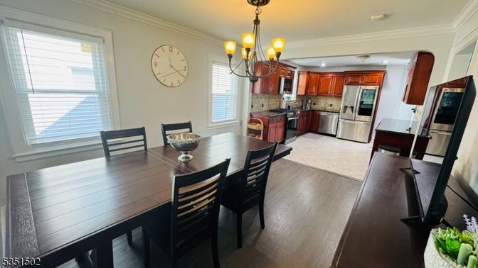 Chandelier, Dining room, Interior, Kitchen, Stainless Steel Appliances, Wood Texture Flooring