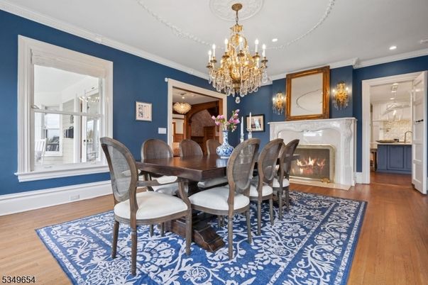 Chandelier, Dining room, Fireplace, Interior, Recessed Lighting, Wood Texture Flooring