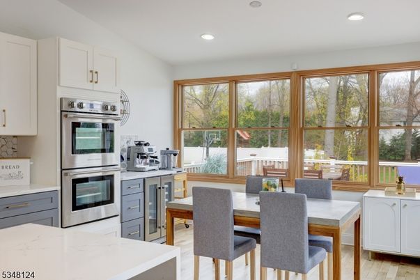 Dining room, Interior, Kitchen, Recessed Lighting, Stainless Steel Appliances, Wood Texture Flooring