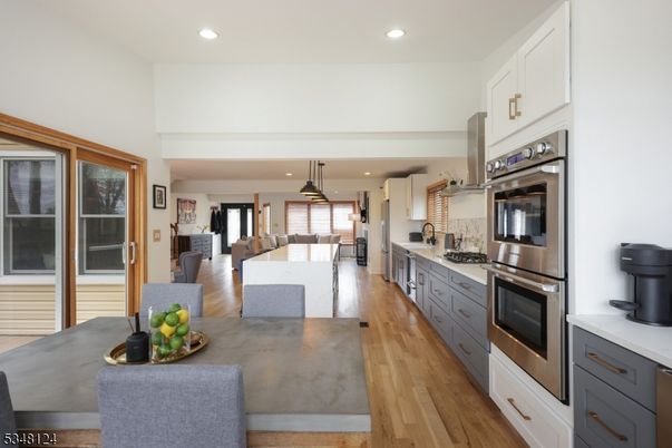 Dining room, Interior, Kitchen, Pendant Lights, Recessed Lighting, Stainless Steel Appliances, Wood Texture Flooring