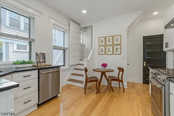 Dining room, Interior, Kitchen, Recessed Lighting, Stainless Steel Appliances, Wood Texture Flooring