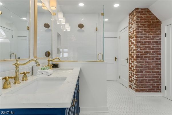 Bathroom, Dual Sink Vanities, Glass Shower, Interior, Recessed Lighting, Stone Walls