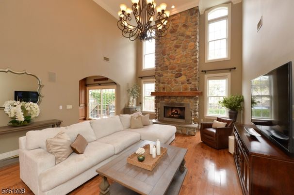 Chandelier, Fireplace, Interior, Living room, Stone Walls, Wood Texture Flooring