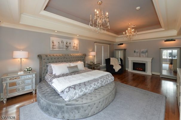 Bedroom, Chandelier, Fireplace, Interior, Recessed Lighting, Wood Texture Flooring
