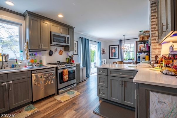 Chandelier, Interior, Kitchen, Pendant Lights, Recessed Lighting, Stainless Steel Appliances, Wood Texture Flooring