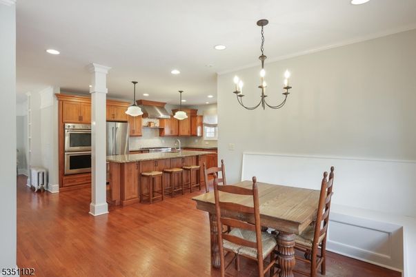 Chandelier, Dining room, Interior, Kitchen, Pendant Lights, Recessed Lighting, Stainless Steel Appliances, Wood Texture Flooring